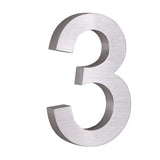 De Angelo RVS 20cm van yessential.nl is een metallic, geborsteld zilveren 3D nummer 3, ideaal als modern huisnummer en tegen een witte achtergrond.