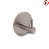 De Rudro Gunmetal van yessential.nl is een geborsteld metalen, zelfklevend handdoekhaakje met een cilindrische knijper en ronde basis, voorzien van een no drill-symbool, zodat het kan worden bevestigd zonder te boren.