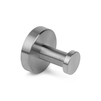 De Mano RVS WC Set van yessential.nl heeft een roestvrijstalen wandhaak met een ronde basis en een cilindrische knijper. De geborstelde afwerking en minimalistische stijl maken hem ideaal voor elke moderne badkameraccessoirecollectie.