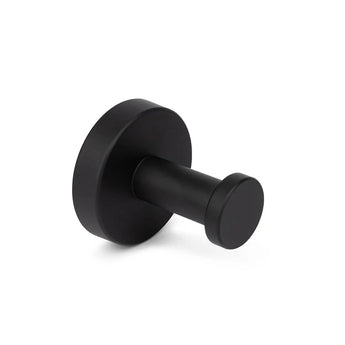 De Mano Black WC set van yessential.nl heeft een ronde, matzwarte wandhaak met een platte ronde voet en een cilindrische knijper - ideaal voor je badkameraccessoires collectie, zoals afgebeeld op een effen witte achtergrond.