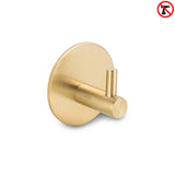 De Rudro Gold van yessential.nl is een gouden cilindervormige handdoekhaak met een ronde basis. Een no-drill icoon geeft aan dat het een handdoekhaak zonder boren is, waardoor installatie eenvoudig is - boren is niet nodig.