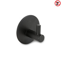 De Rudro Black handdoekhaak van yessential.nl heeft een ronde basis en cilindrische pin, is zelfklevend voor montage zonder boren en herkenbaar aan het no-drill symbool rechtsboven.