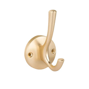 De Eduardo Gold Deluxe van yessential.nl is een goudkleurige metalen wandhaak met een ronde basis en twee tanden, ideaal voor het ophangen van jassen of hoeden. Deze kapstokhaak goud monteert eenvoudig met twee zichtbare schroeven.