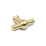 De Rando Gold knop van yessential.nl heeft een afwerking in gepolijst messing en een rond midden met twee loodrechte handgrepen - een elegant, modern accent dat ideaal is voor het opwinden van mechanische uurwerken of muziekdoosjes.