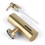De Alberto Gold van yessential.nl is een goudkleurige RVS zeepdispenser met pomp en draaiknop aan de zijkant. De dispenser is gedemonteerd afgebeeld met een verticaal venster voor het bekijken van de inhoud. Geschikt voor muurbevestiging.