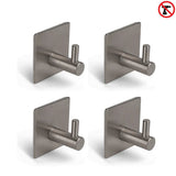 Vier yessential.nl 4x Navarro Gunmetal handdoekhaken met vierkante plaat zijn in een grid gerangschikt; een rood "no drill" symbool rechtsboven toont aan dat deze zelfklevende haken snel te installeren zijn zonder boren.