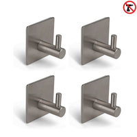 Vier yessential.nl 4x Navarro Gunmetal handdoekhaken met vierkante plaat zijn in een grid gerangschikt; een rood "no drill" symbool rechtsboven toont aan dat deze zelfklevende haken snel te installeren zijn zonder boren.