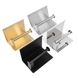 Vier stijlvolle toiletrolhouders van yessential.nl, waaronder de Tazio Chrome, in goud, zilver, zwart en chroom staan op een witte achtergrond. Ze hebben allemaal een modern rechthoekig ontwerp met een horizontale houder voor de toiletrol.