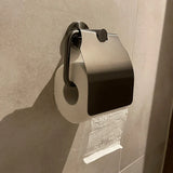 De Sandro Gunmetal WC-set van yessential.nl heeft een wc-papierrol op een wandhouder met metalen deksel, papier over de bovenkant en afrolbaar vanaf de wand - een ideale stijlvolle gunmetal toiletaccessoire voor de moderne badkamer.